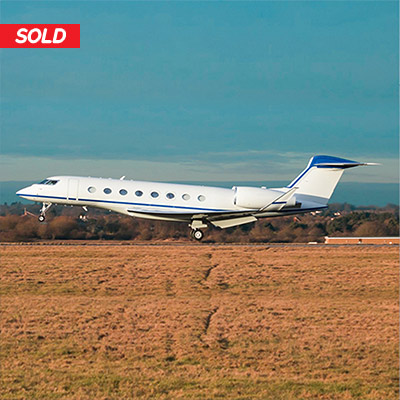 Gulsftream G650ER sold by Leviate Air Group. White base paint with blue stripes taking off with blue skies above. contact info@leviateair.com